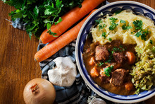 Traditional Irish Stew Served With Potatoes And Cabbage
