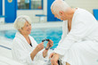 © auremar - beautiful senior couple enjoying spa wellness treatments