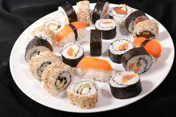 Wall Mural - assorted of maki, sushi and rolls with salmon, shrimp and avocado- japanese sushi food