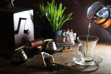 Wall Mural - Brewing tea on a wooden table