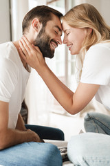 Poster - Beautiful young couple relaxing on bed