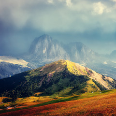 Aufkleber - Unsurpassed sunset in the mountains. Scenic image of famous Sassolungo peak with overcast Dramatic sky. Wonderful Vall Gardena under sunlight. Majestic Dolomites Mountains. Amazing nature Landscape