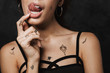 © Drobot Dean - Cropped image of young seductive woman licking her lips