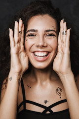 Poster - Image of nice cheerful woman laughing and touching her face