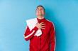 © Asier - Young sport man laughs out loudly keeping hand on chest.