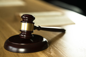 Symbol of law and justice on wooden table in lawyer office