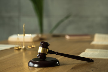 Wall Mural - Symbol of law and justice on wooden table in lawyer office