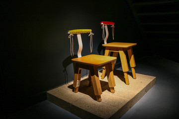 the two chair  made by wood under the spotlight