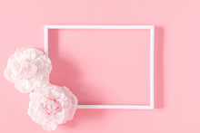 Beautiful Flowers Composition. Blank Frame For Text, Pink Flowers On Pastel Pink Background. Valentines Day, Easter, Birthday, Mother's Day. Flat Lay, Top View, Copy Space