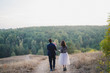 © anna_gorbenko - Young happy caucasian couple with little baby girl. Parents and daughter walking and having fun together. Mother and father play with child outdoors. Family, parenthood, childhood, happiness concept.