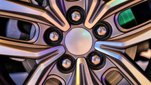 Closeup On A Chrome Wheel Rim With Colorful Mood Lighting Reflections, All Distinctive Or Trademark Details Were Cloned Out