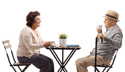 Canvas Print - Seniors drinking coffee at a table