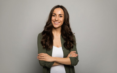 mrs. excellence. close-up photo of adorable woman, posing in white t-shirts and smiling while lookin