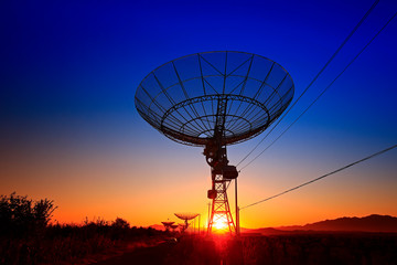 Wall Mural - the silhouette of a radio telescope observatory