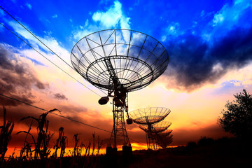 Wall Mural - the silhouette of a radio telescope observatory