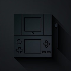 Poster - Paper cut Portable video game console icon isolated on black background. Gamepad sign. Gaming concept. Paper art style. Vector Illustration