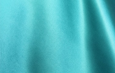 Wall Mural - Turquoise satin background. Silk fabric with pleats. Satin, silk or satin create a beautiful drape. Fashion design, background.
