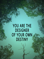 Wall Mural - Motivational and inspirational wording - You Are The Designer Of You Own Destiny. Blurred styled background.