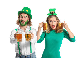 Young couple with beer on white background. St. Patrick's Day celebration