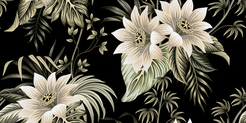 Tropical vintage lotus flower, palm leaves, liana floral seamless pattern black background. Exotic jungle wallpaper.