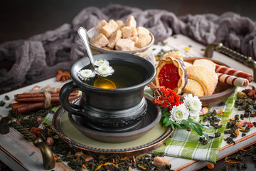 Tea hot drink on old background in composition on the table