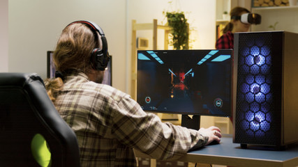 Wall Mural - Man keeping his head on desk after losing at video games on computer