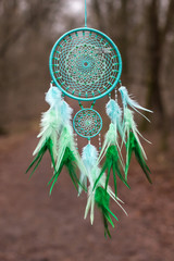 Wall Mural - Handmade dream catcher with feathers threads and beads rope hanging