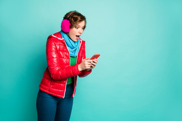 Wall Mural - Finally. Profile photo of pretty shocked lady chatting telephone reading friends engagement email wear red coat scarf pink ear covers sweater pants isolated teal color background