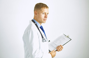 Wall Mural - Young confident doctor in a white coat with a stethoscope