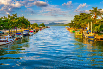 Fototapete - Canal in historical center of Paraty, Rio de Janeiro, Brazil. Paraty is a preserved Portuguese colonial and Brazilian Imperial municipality. Cityscape of Paraty