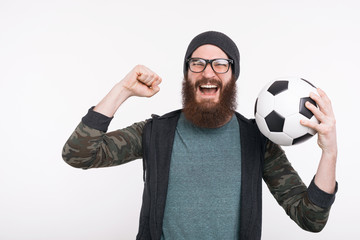 Wall Mural - Photo of screaming man holding soccer ball