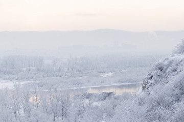 Wall Mural - Winter landscape - foggy view of the cliff edge and into the dis