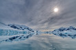 Cold arctic landscape reflecting in water
