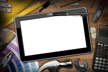 Digital tablet with empty screen on a wooden table with DIY work tools, calculator and Euro currency. Home Improvement concept