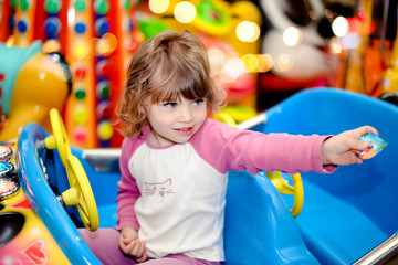 Wall Mural - cute little girl at a fun fair