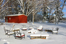 Beautiful Midwest Snowy Winter Nature Background. Scenic Rural View With Covered By Fresh Snow Backyard Of The Private House With Outdoor Furniture And Red Barn. Wisconsin Countryside, Wausau Area.