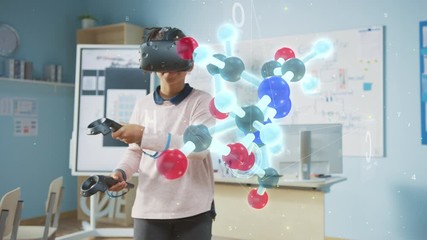 Fototapete - Cute Girl Wearing Augmented Reality Headset and Using Controllers Interacts with 3D Molecule. Futuristic School Science Class for Children Learning in STEM Programs. VFX, Special Effects Render