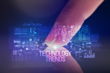 Finger touching tablet with web technology icons and TECHNOLOGY TRENDS inscription