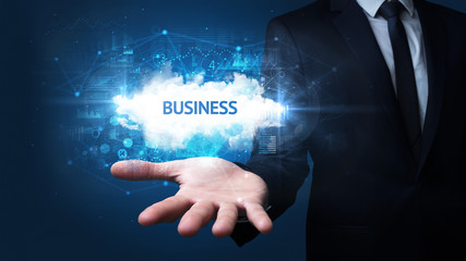 Hand of Businessman holding BUSINESS inscription, successful business concept