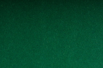 monochrome green, textured color cardboard background