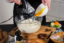 Hands Beating Egg Whites Cream With Mixer In The Bowl.