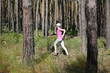 Healthy lifestyle concept. Portrait of young sporty girl running in the park 