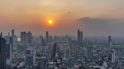 Wall Mural - 4K Day to Night timelapse of Sunset scence of modern office buildings and condominium in Bangkok city downtown with sunset sky and clouds at Bangkok , Thailand.