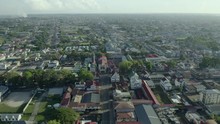Birds Eye View Of The Cultural And Historic City Of Paramaribo, Capital Of Suriname. Aerial, Backward Moving. 