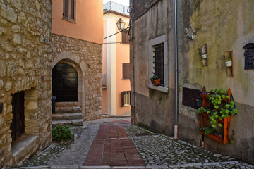  Veroli, Italy, 01/03/2020. A narrow street between the old houses of a medieval village
