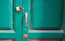 Green Old Dirty Door With A Lock And Key Hole