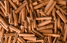 Cinnamon Background. Pile Of Cinnamons Stick Top View.