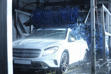 Modern Auto Undergoing Cleaning At Car Wash