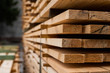 Piles of wooden boards in the sawmill, planking. Warehouse for sawing boards on a sawmill outdoors. Wood timber stack of wooden blanks construction material. Industry.