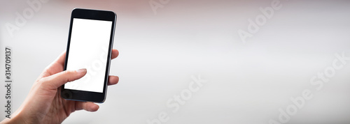 Fotografía Hands Holding Cell Phone With Blank Screen